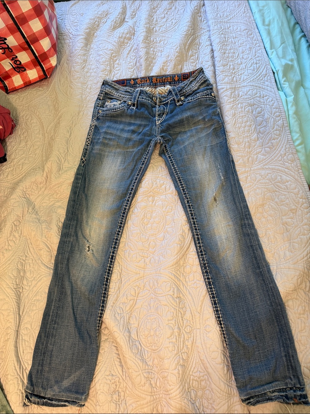 Rock Revival Women's Faded Blue Skinny Jeans with Subtle Distress
